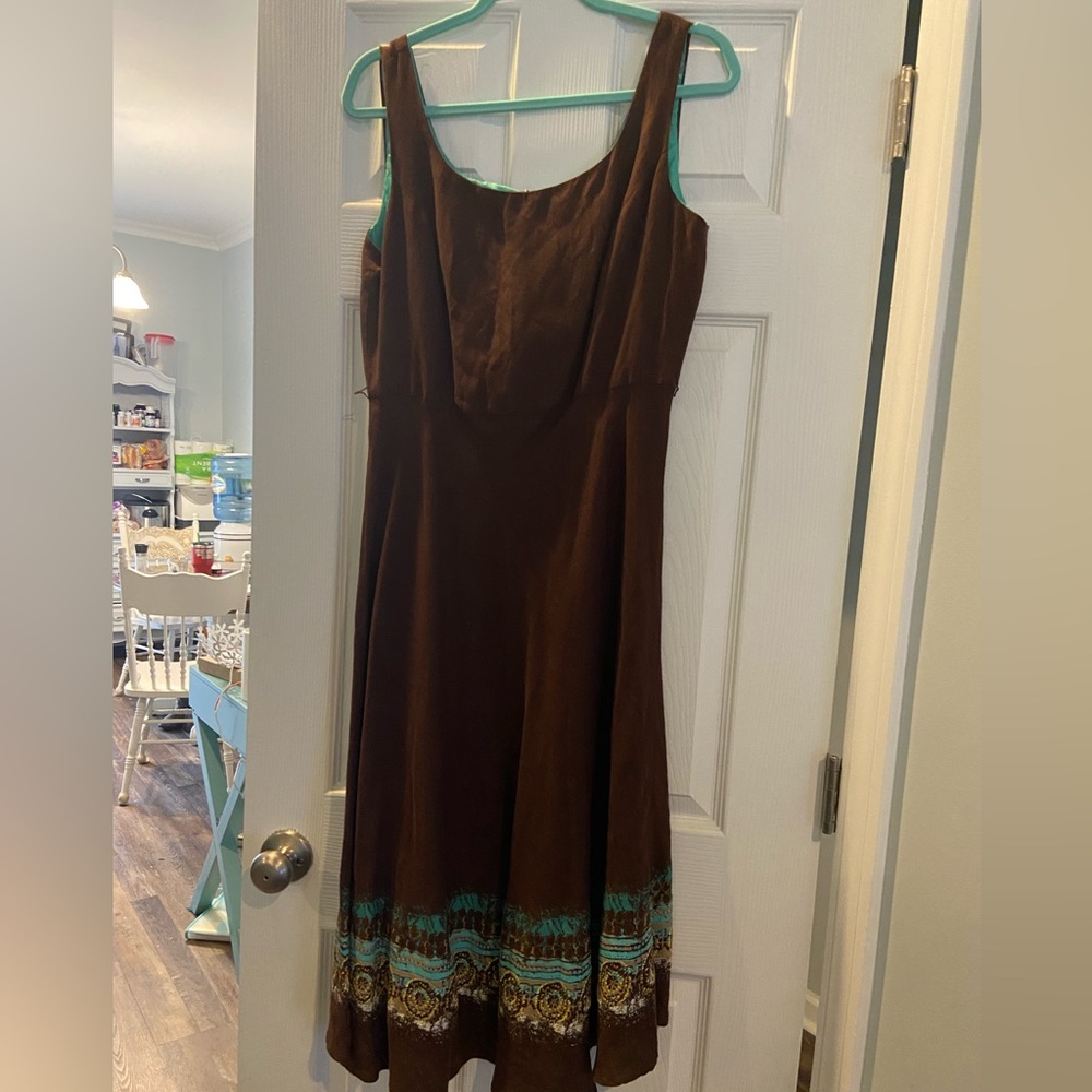 Brown with teal design at bottom hem